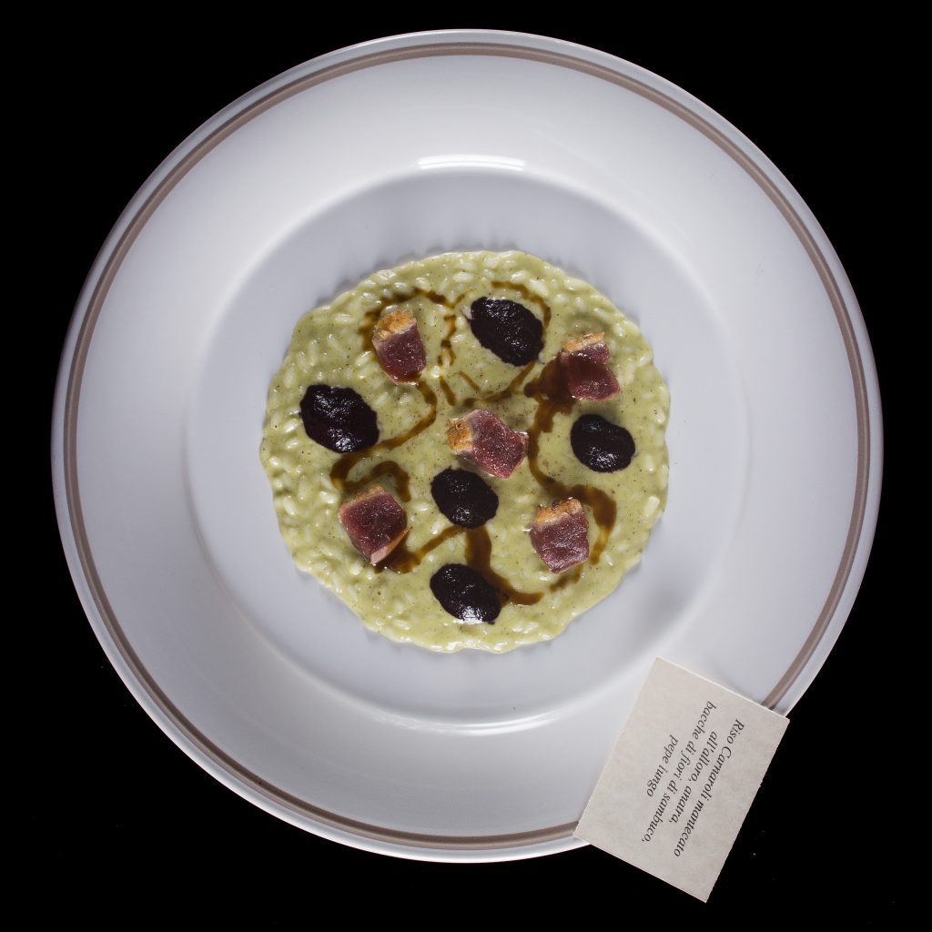 Riso-carnaroli-mantecatoall-alloro- anatra-succo-di-bacche-di-sambuco-pepe-lungo
