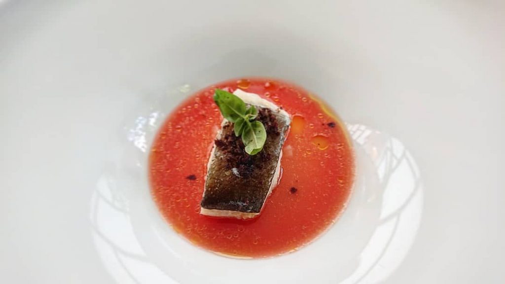 Baccalà in umido, acqua di pomodoro macerato e polvere di olive taggiasche