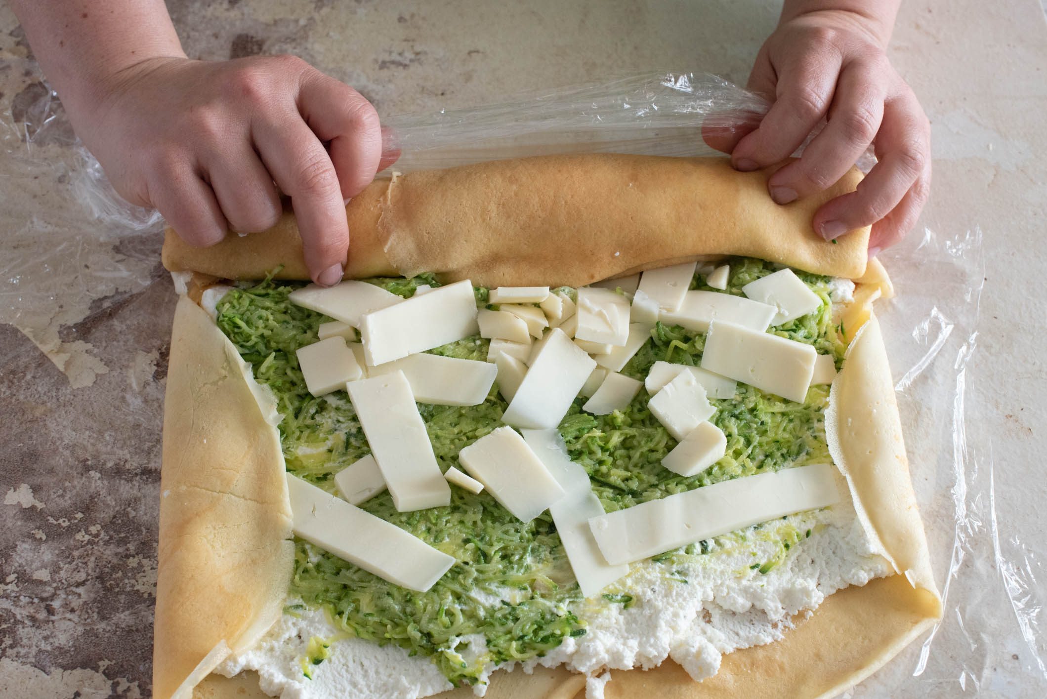 Rotolo di crespelle con zucchine